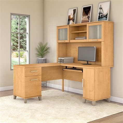 Bush desk - Description. The Bush Furniture Cabot 60W L Shaped Computer Desk offers a spacious and efficient workspace for your home office. Enjoy a beautiful traditional look with smart features for your convenience. The L Shaped Desk design provides a large, durable work surface and just the right amount of storage to keep you feeling neat and organized. 